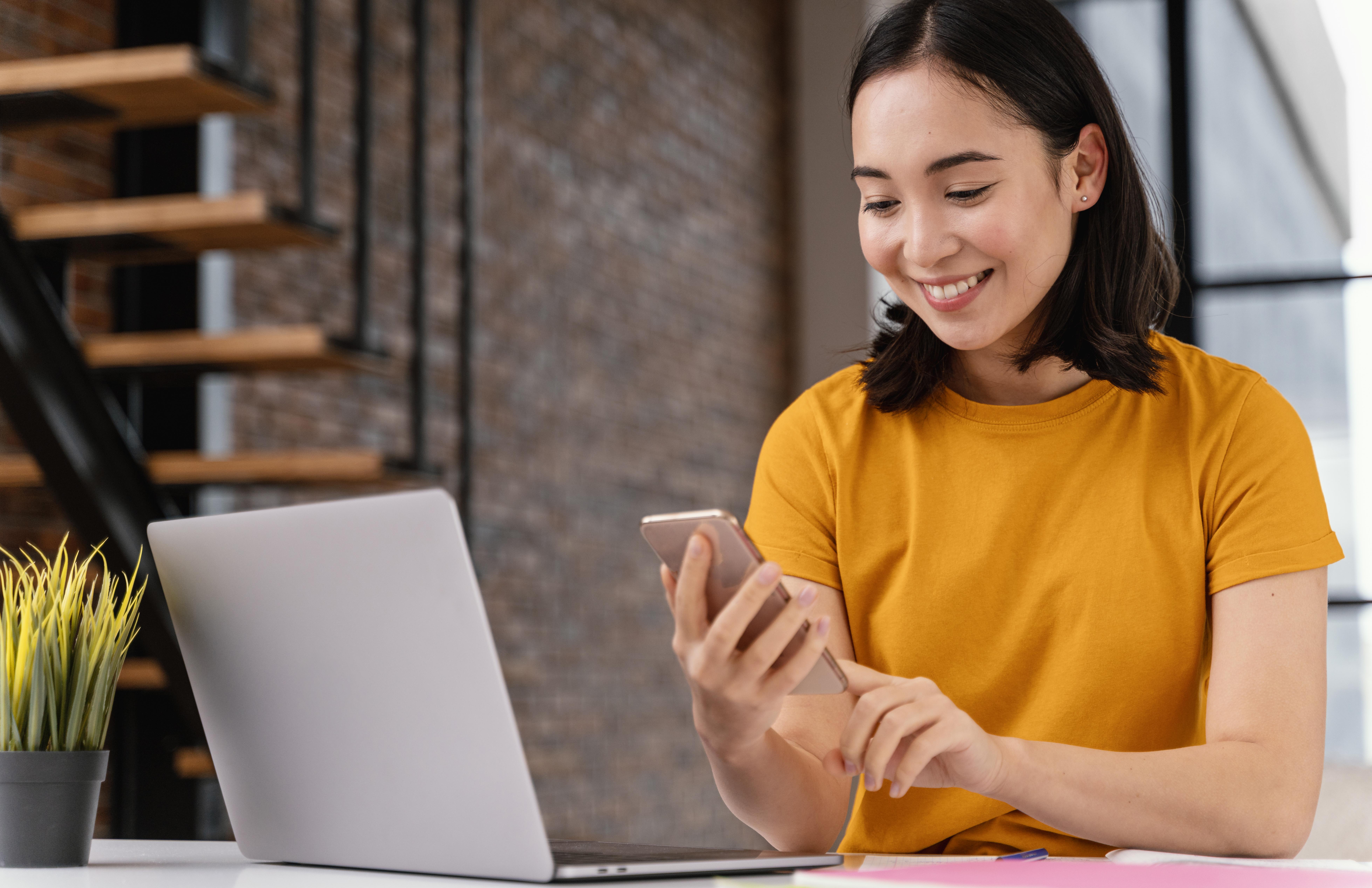 young-woman-using-phone-while-attending-online-class